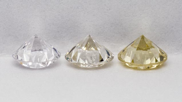 These diamonds—graded E, K, and Z—represent diamond colors near the top, middle, and bottom of the GIA Color Scale. – © GIA & Tino Hammid